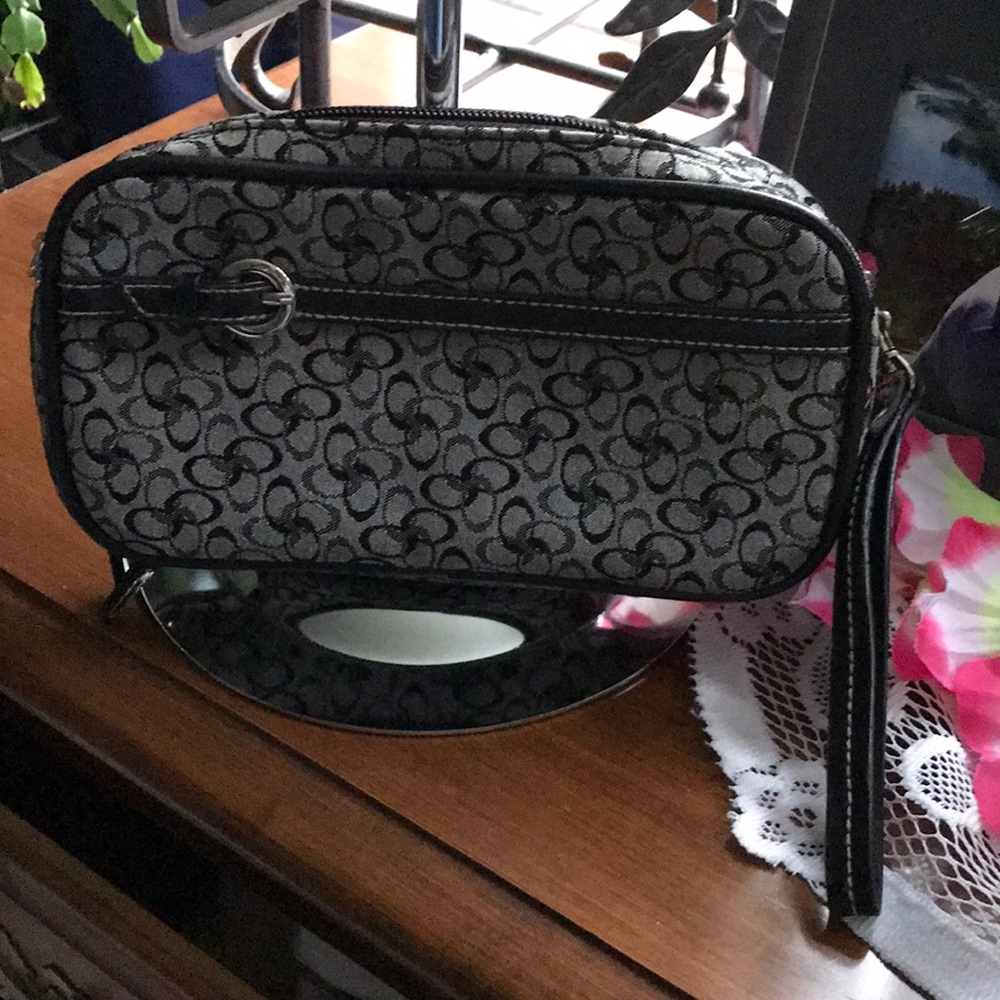 Roomy clutch with Double Zip Closure.